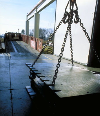 A die being lifted by a hoist